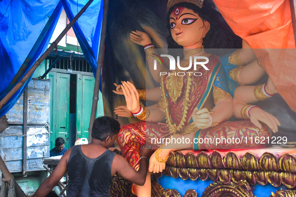 An artisan paints an idol of the Hindu goddess Durga at a workshop ahead of the Durga Puja festival in Kolkata, India, on September 29, 2024...