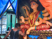 An artisan paints an idol of the Hindu goddess Durga at a workshop ahead of the Durga Puja festival in Kolkata, India, on September 29, 2024...