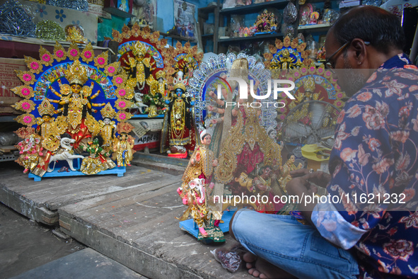 An idol maker makes miniature goddess Durga at a workshop ahead of the Durga Puja festival in Kolkata, India, on September 29, 2024. 