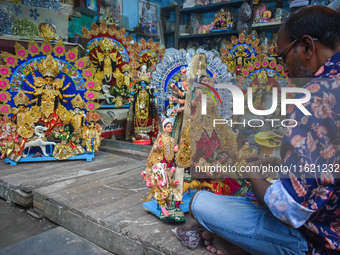 An idol maker makes miniature goddess Durga at a workshop ahead of the Durga Puja festival in Kolkata, India, on September 29, 2024. (