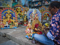 An idol maker makes miniature goddess Durga at a workshop ahead of the Durga Puja festival in Kolkata, India, on September 29, 2024. (