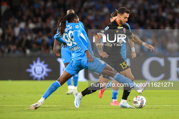 Pedro Pereira of AC Monza competes for the ball with Andre-Frank Zambo Anguissa of SSC Napoli during the Serie A match between SSC Napoli an...