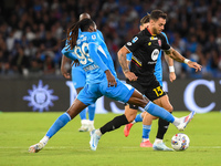 Pedro Pereira of AC Monza competes for the ball with Andre-Frank Zambo Anguissa of SSC Napoli during the Serie A match between SSC Napoli an...