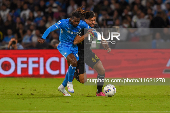 Andrea Carboni of AC Monza competes for the ball with Andre-Frank Zambo Anguissa of SSC Napoli during the Serie A match between SSC Napoli a...