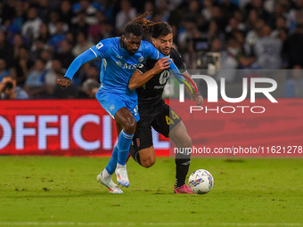 Andrea Carboni of AC Monza competes for the ball with Andre-Frank Zambo Anguissa of SSC Napoli during the Serie A match between SSC Napoli a...