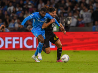 Andrea Carboni of AC Monza competes for the ball with Andre-Frank Zambo Anguissa of SSC Napoli during the Serie A match between SSC Napoli a...