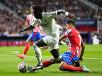 Vinicius Junior left winger of Real Madrid and Brazil and Nahuel Molina right-back of Atletico de Madrid and Argentina compete for the ball...