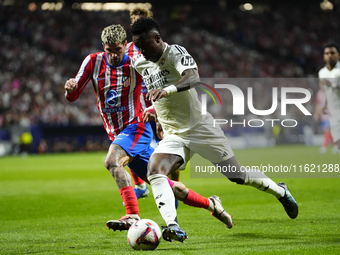 Vinicius Junior left winger of Real Madrid and Brazil and Rodrigo de Paul central midfield of Atletico de Madrid and Argentina and Spaincomp...