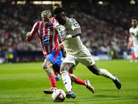 Vinicius Junior left winger of Real Madrid and Brazil and Rodrigo de Paul central midfield of Atletico de Madrid and Argentina and Spaincomp...