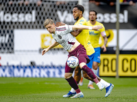 AFC Ajax Amsterdam midfielder Kenneth Taylor and RKC player Denilho Cleonise during the match RKC - Ajax at the Mandemakers Stadium for the...