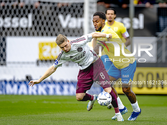 AFC Ajax Amsterdam midfielder Kenneth Taylor and RKC player Denilho Cleonise during the match RKC - Ajax at the Mandemakers Stadium for the...