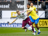 AFC Ajax Amsterdam midfielder Kenneth Taylor and RKC player Denilho Cleonise during the match RKC - Ajax at the Mandemakers Stadium for the...