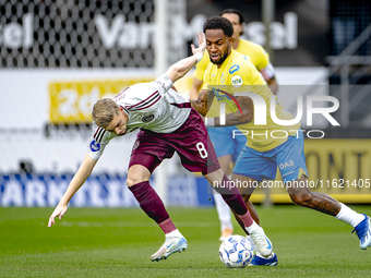 AFC Ajax Amsterdam midfielder Kenneth Taylor and RKC player Denilho Cleonise during the match RKC - Ajax at the Mandemakers Stadium for the...