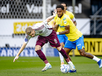 AFC Ajax Amsterdam midfielder Kenneth Taylor and RKC player Denilho Cleonise during the match RKC - Ajax at the Mandemakers Stadium for the...