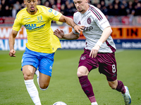 RKC player Daouda Weidmann and AFC Ajax Amsterdam midfielder Kenneth Taylor during the match RKC - Ajax at the Mandemakers Stadium for the D...