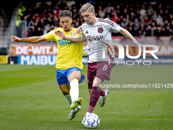 RKC player Daouda Weidmann and AFC Ajax Amsterdam midfielder Kenneth Taylor during the match RKC - Ajax at the Mandemakers Stadium for the D...