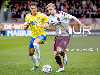 RKC player Daouda Weidmann and AFC Ajax Amsterdam midfielder Kenneth Taylor during the match RKC - Ajax at the Mandemakers Stadium for the D...