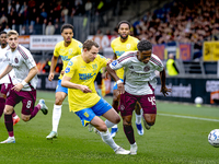 RKC player Julian Lelieveld and AFC Ajax Amsterdam forward Jaydon Banel during the match RKC vs. Ajax at the Mandemakers Stadium for the Dut...