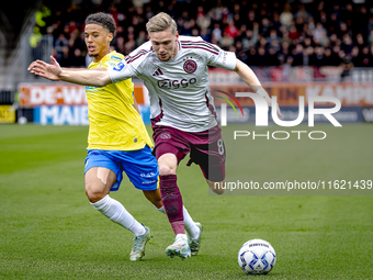 RKC player Daouda Weidmann and AFC Ajax Amsterdam midfielder Kenneth Taylor during the match RKC - Ajax at the Mandemakers Stadium for the D...