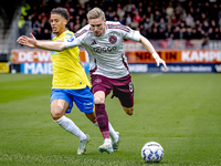 RKC player Daouda Weidmann and AFC Ajax Amsterdam midfielder Kenneth Taylor during the match RKC - Ajax at the Mandemakers Stadium for the D...