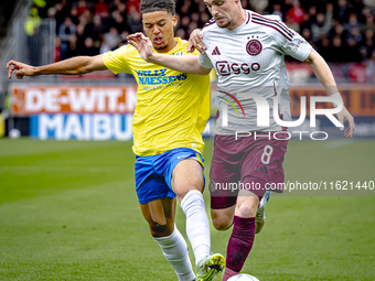 RKC player Daouda Weidmann and AFC Ajax Amsterdam midfielder Kenneth Taylor during the match RKC - Ajax at the Mandemakers Stadium for the D...