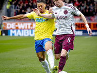 RKC player Daouda Weidmann and AFC Ajax Amsterdam midfielder Kenneth Taylor during the match RKC - Ajax at the Mandemakers Stadium for the D...