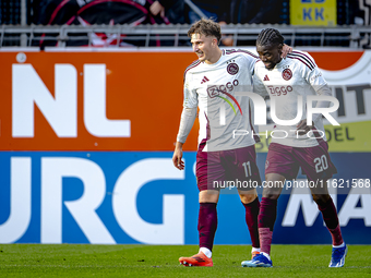 Players of Ajax celebrate the goal during the match RKC - Ajax at the Mandemakers Stadium for the Dutch Eredivisie season 2024-2025 in Waalw...