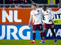 Players of Ajax celebrate the goal during the match RKC - Ajax at the Mandemakers Stadium for the Dutch Eredivisie season 2024-2025 in Waalw...