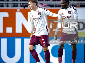 Players of Ajax celebrate the goal during the match RKC - Ajax at the Mandemakers Stadium for the Dutch Eredivisie season 2024-2025 in Waalw...