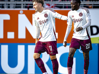 Players of Ajax celebrate the goal during the match RKC - Ajax at the Mandemakers Stadium for the Dutch Eredivisie season 2024-2025 in Waalw...