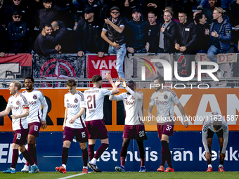 Players of Ajax celebrate the goal during the match RKC - Ajax at the Mandemakers Stadium for the Dutch Eredivisie season 2024-2025 in Waalw...