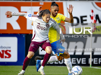 AFC Ajax Amsterdam midfielder Kian Fitz-Jim and RKC player Alexander Jakobsen during the match RKC - Ajax at the Mandemakers Stadium for the...