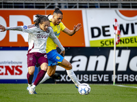 AFC Ajax Amsterdam midfielder Kian Fitz-Jim and RKC player Alexander Jakobsen during the match RKC - Ajax at the Mandemakers Stadium for the...