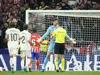 Thibaut Courtois goalkeeper of Real Madrid and Belgium talks to the referee about the throwing of objects by the Atletico supporters.during...