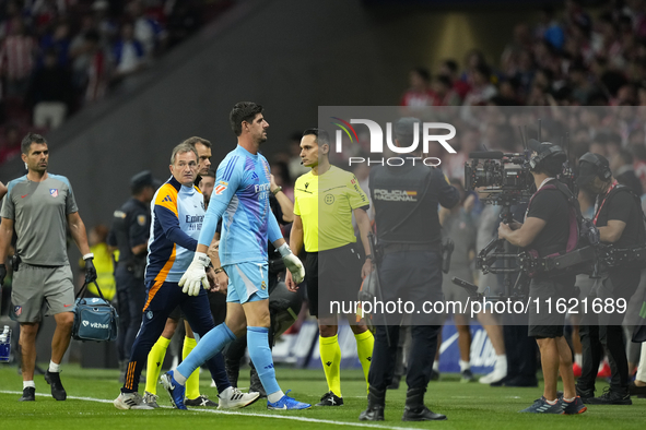 Thibaut Courtois goalkeeper of Real Madrid and Belgium retire because of the temporary suspension of the match due to the throwing of object...