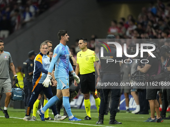 Thibaut Courtois goalkeeper of Real Madrid and Belgium retire because of the temporary suspension of the match due to the throwing of object...