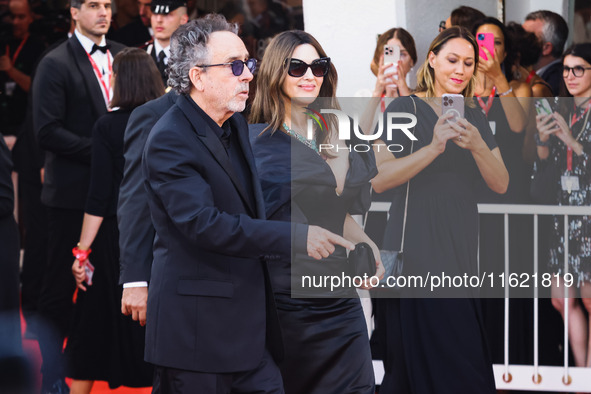 Tim Burton and Monica Bellucci attend the red carpet for the premiere of Beetlejuice Beetlejuice during the 81st Venice International Film F...