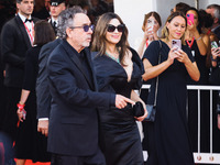 Tim Burton and Monica Bellucci attend the red carpet for the premiere of Beetlejuice Beetlejuice during the 81st Venice International Film F...