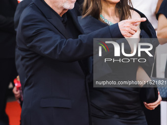 Tim Burton and Monica Bellucci attend the red carpet for the premiere of Beetlejuice Beetlejuice during the 81st Venice International Film F...