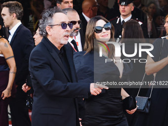 Tim Burton and Monica Bellucci attend the red carpet for the premiere of Beetlejuice Beetlejuice during the 81st Venice International Film F...