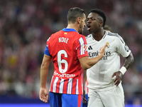 Vinicius Junior left winger of Real Madrid and Brazil and Koke Resurreccion central midfield of Atletico de Madrid and Spain  argues during...