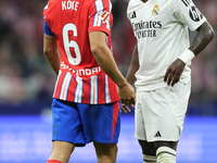 Vinicius Junior left winger of Real Madrid and Brazil and Koke Resurreccion central midfield of Atletico de Madrid and Spain  argues during...