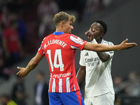 Vinicius Junior left winger of Real Madrid and Brazil and   Marcos Llorente central midfield of Atletico de Madrid and Spain argues during t...