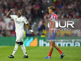 Vinicius Junior left winger of Real Madrid and Brazil and   Marcos Llorente central midfield of Atletico de Madrid and Spain argues during t...