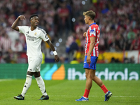 Vinicius Junior left winger of Real Madrid and Brazil and   Marcos Llorente central midfield of Atletico de Madrid and Spain argues during t...