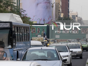 A giant banner featuring a portrait of Lebanon's Hezbollah Secretary General, Hassan Nasrallah, who was killed in an Israeli air strike in a...