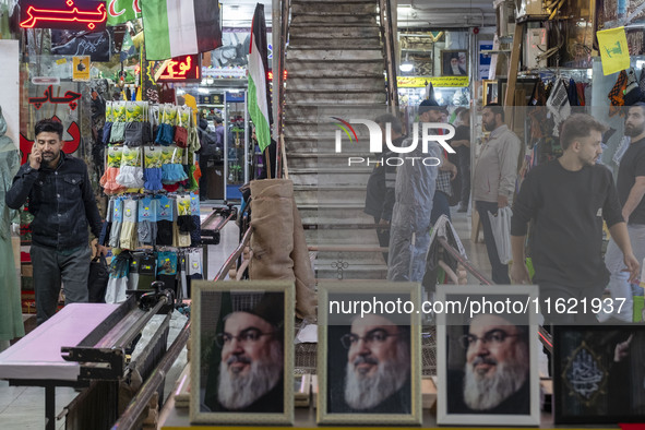 A framed portrait of Lebanon's Hezbollah Secretary General, Hassan Nasrallah, who was killed in an Israeli air strike in a suburb of Beirut,...