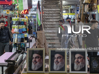 A framed portrait of Lebanon's Hezbollah Secretary General, Hassan Nasrallah, who was killed in an Israeli air strike in a suburb of Beirut,...