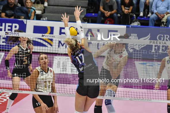 #17 Anna Gray of Chieri '76 blocks the attack of #18 Zehra Gunes of VakifBank Spor Kulubu during the International Trophy ''Una squadra per...