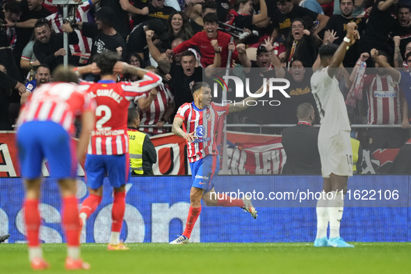 Angel Correa right winger of Atletico de Madrid and Argentina celebrates after scoring his sides first goal during the LaLiga match between...